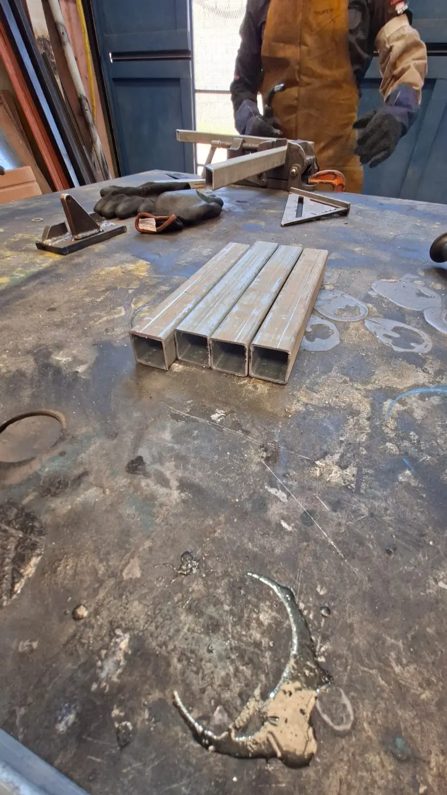 Cutting galvanized PTR profiles for the cart frame in the shop